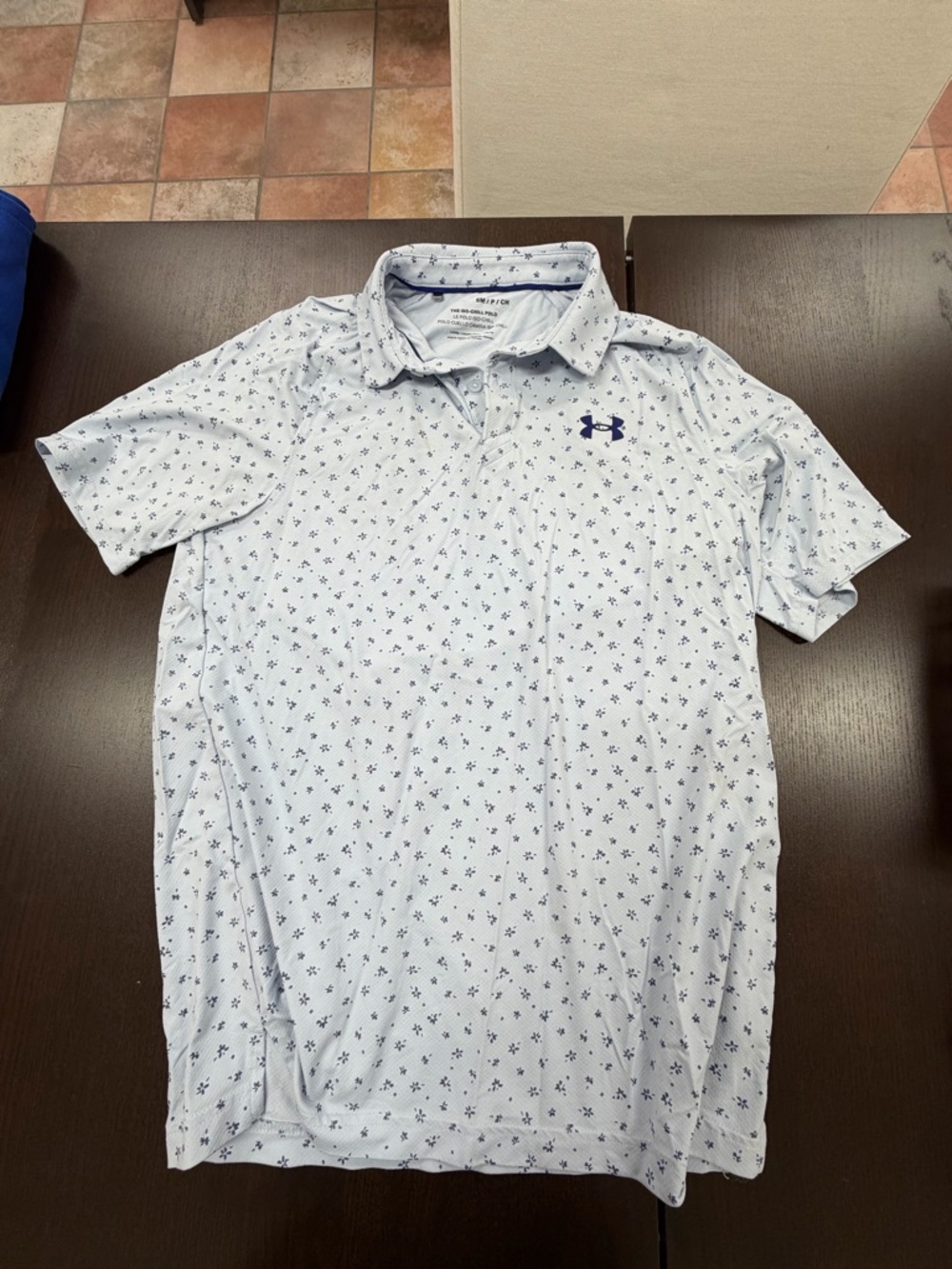 One small Under Armour golf tee